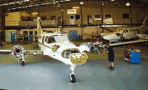 TAE engineers working on a Cessna Conquest. (TAE)